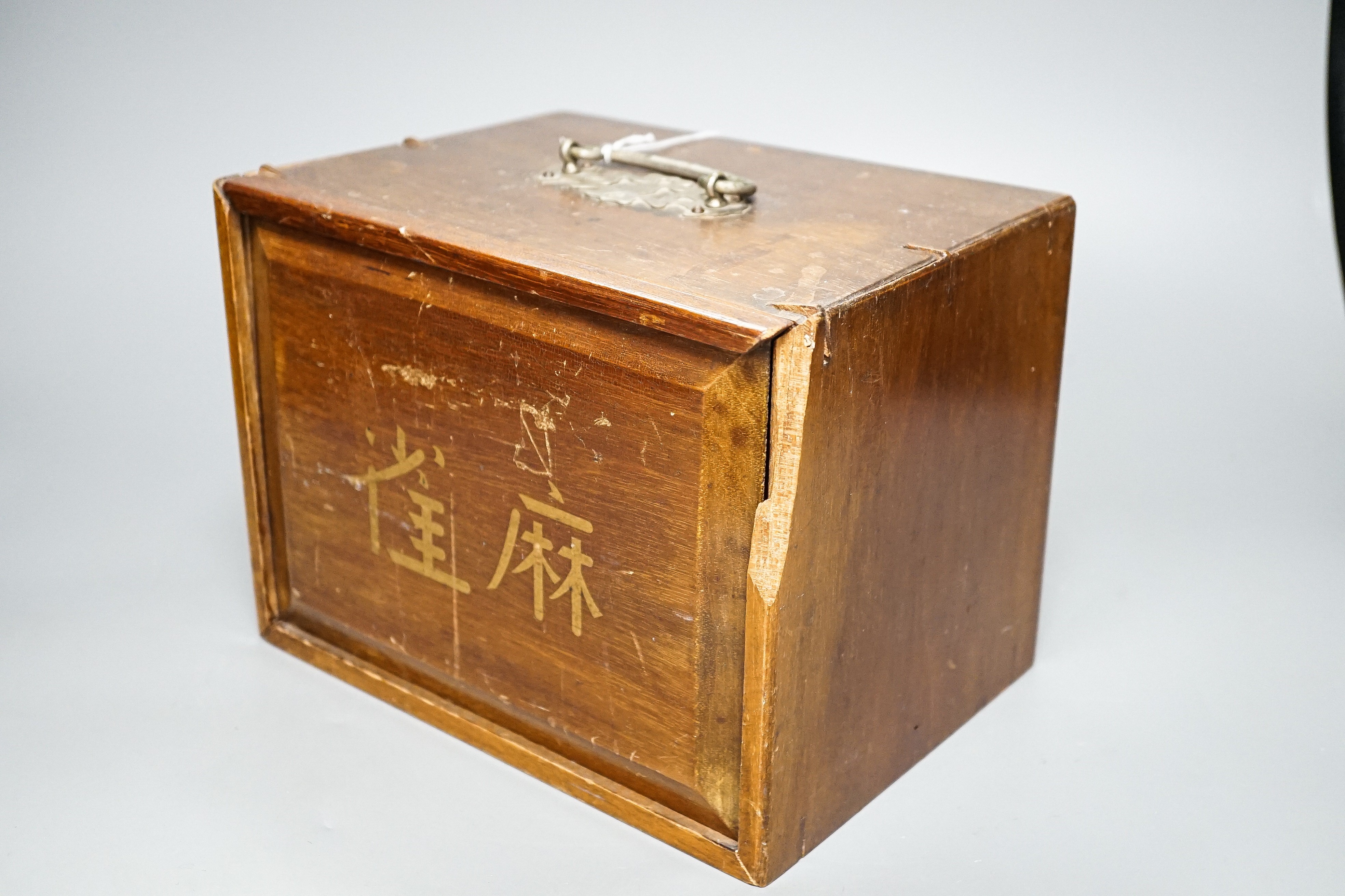 A Mah Jong set in wooden box, 17 cms high.